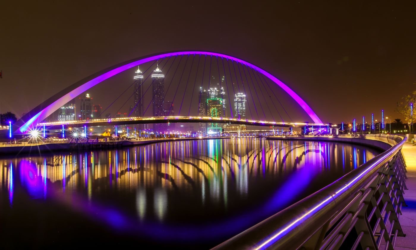 Illuminated Tolerance Bridge over the Dubai Water Canal at night